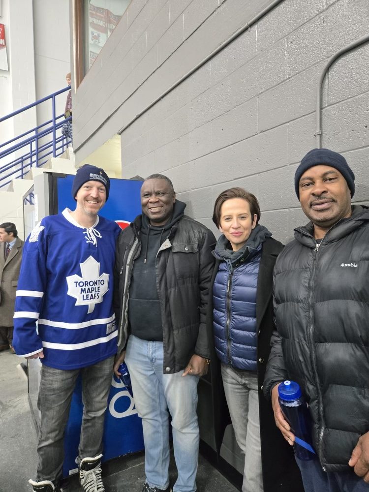 Fitz-Roy Gordon with community members at a local arena