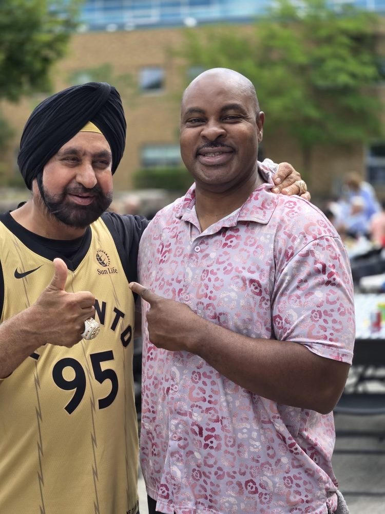 Fitz-Roy Gordon with a Toronto Raptors fan at a community event